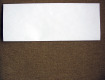 Fold the paper in half the long way to make a crease down the middle. Step 1