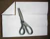 Unfold it again. Fold a corner to the newest crease. Cut out the triangle. Step 3