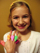 Photo of Sarah and her five origami heart rings
