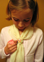 Photo of Sarah and her origami heart scarf holder