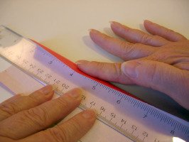 Using a ruler to help with a fold