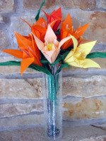 Origami lilies in vase